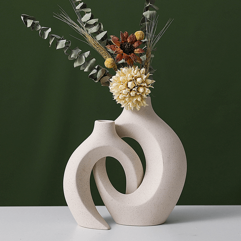 Chic Boho hollow Nordic modern ceramic vase set with dried flowers, perfect for stylish home decor.