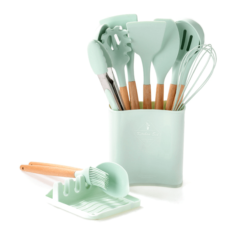 12-piece silicone kitchen tools set in mint green with wooden handles, including spatulas and tongs for easy cooking.