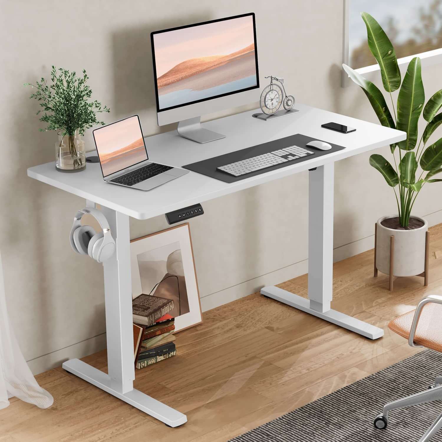 Ergonomic Height Adjustable Table with computer setup and plants in a stylish home office.