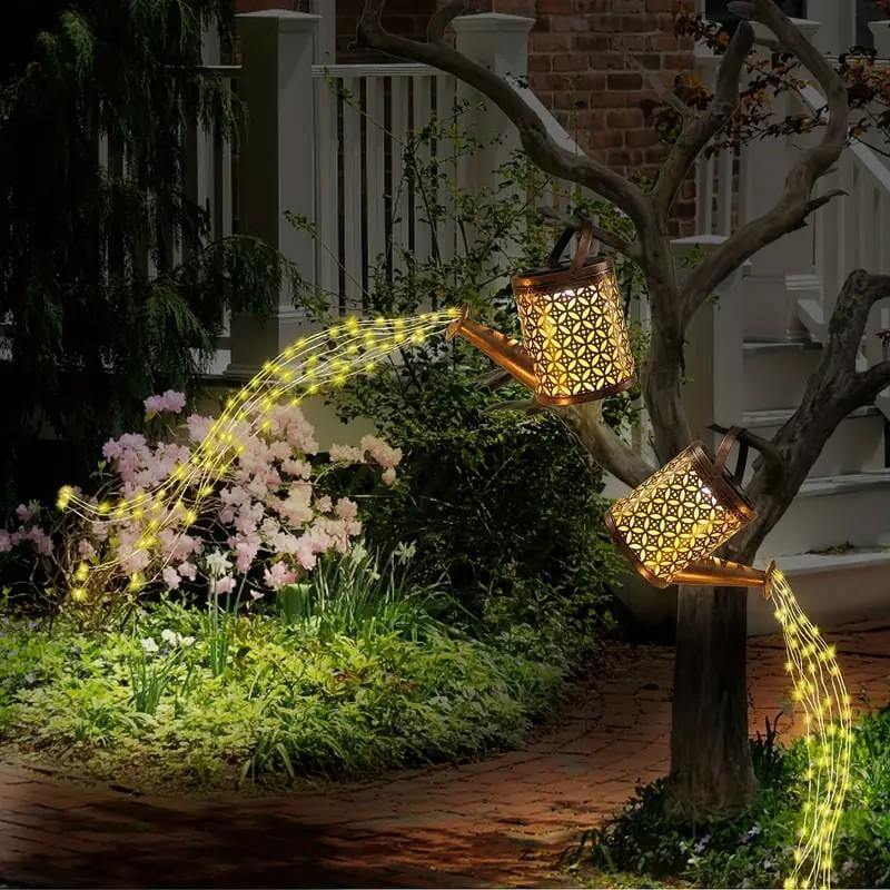 solar watering can string lights garden glow at dusk