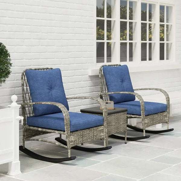 Rattan Chaise Lounge Chair set with blue cushions and matching side table on patio