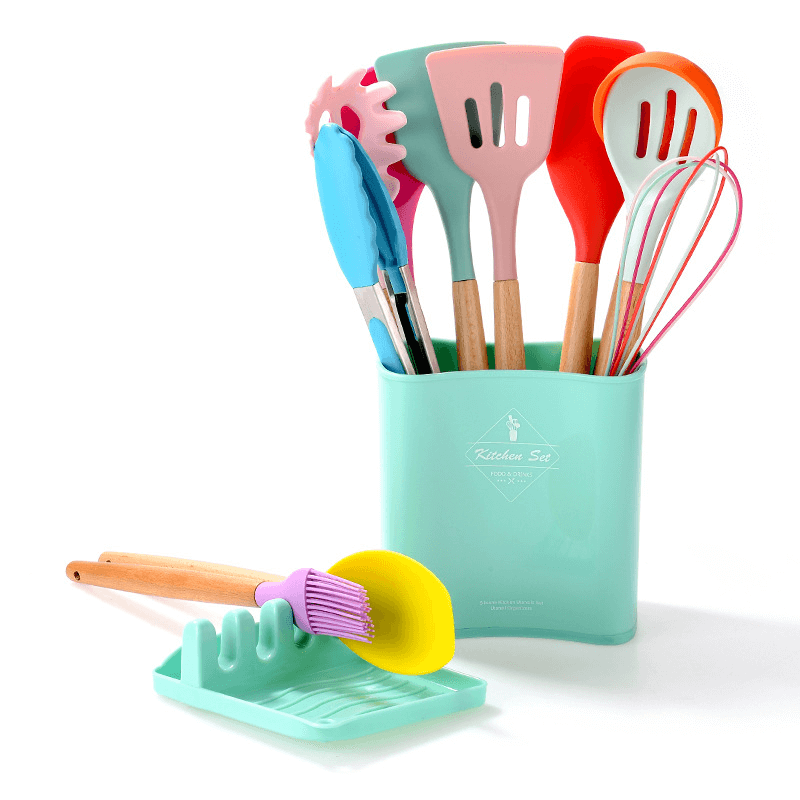 Colorful silicone kitchen tools set with wooden handles in a teal holder, perfect for cooking and easy to clean.
