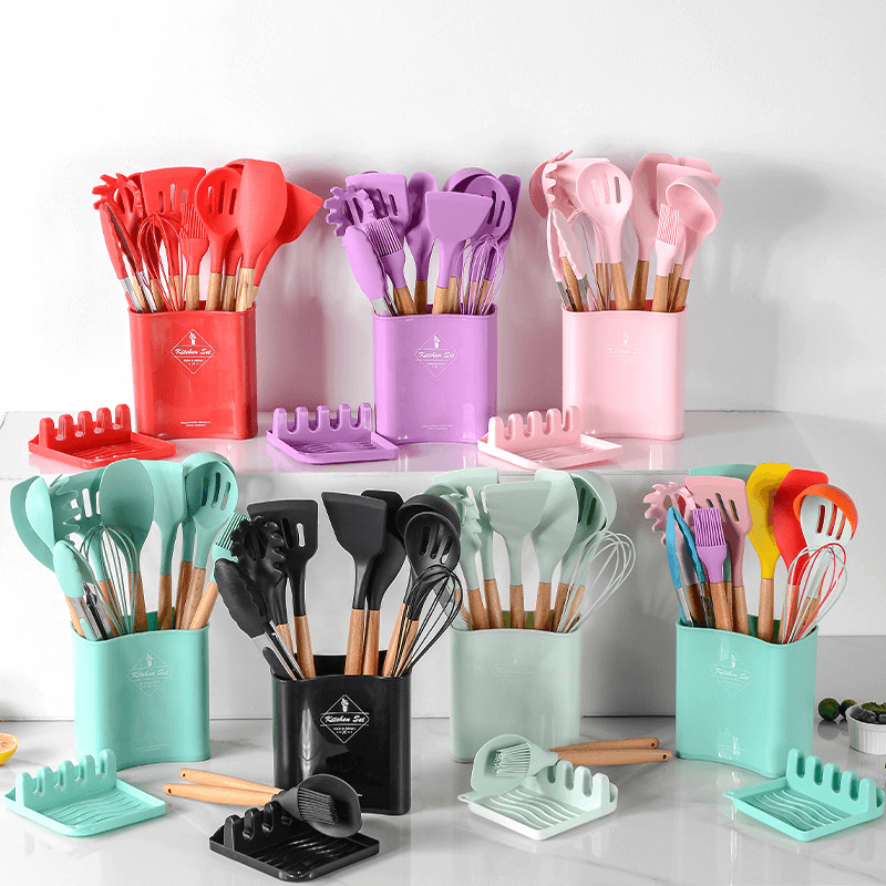 Colorful silicone kitchen tools set with wooden handles displayed in various holders, ideal for stylish cooking.