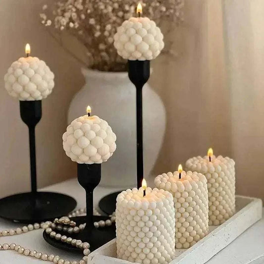 Elegant bubble candles displayed on a tray, showcasing unique shapes, perfect for home decor and ambiance.