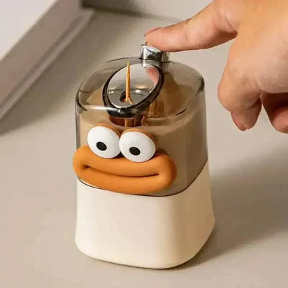 Pop-up toothpick holder with cute design, features push button for single toothpick dispensing and organized storage.