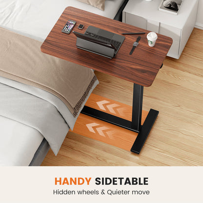 mobile laptop desk with adjustable height in brown finish with laptop on sofa