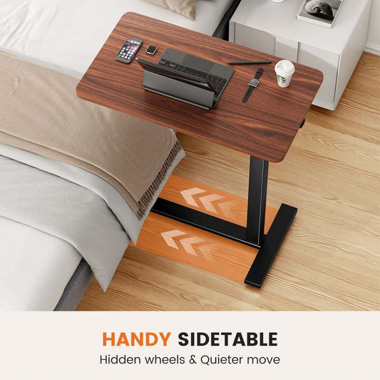 mobile laptop desk with adjustable height in brown finish with laptop on sofa