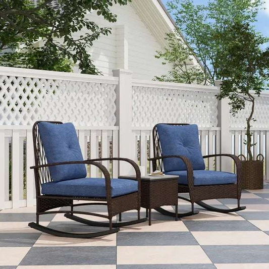 Outdoor Rattan Chaise Lounge Chair and matching side table set with blue cushions on a checkered patio.