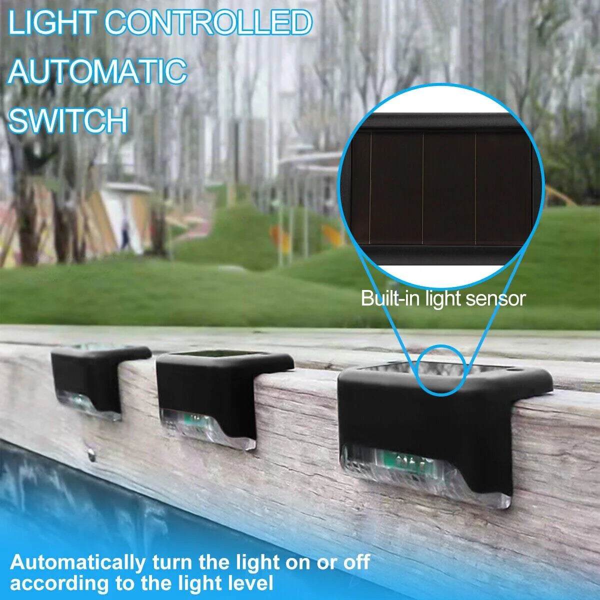 Black solar deck lights with built-in light sensor mounted on wooden deck railing, automatic light control function