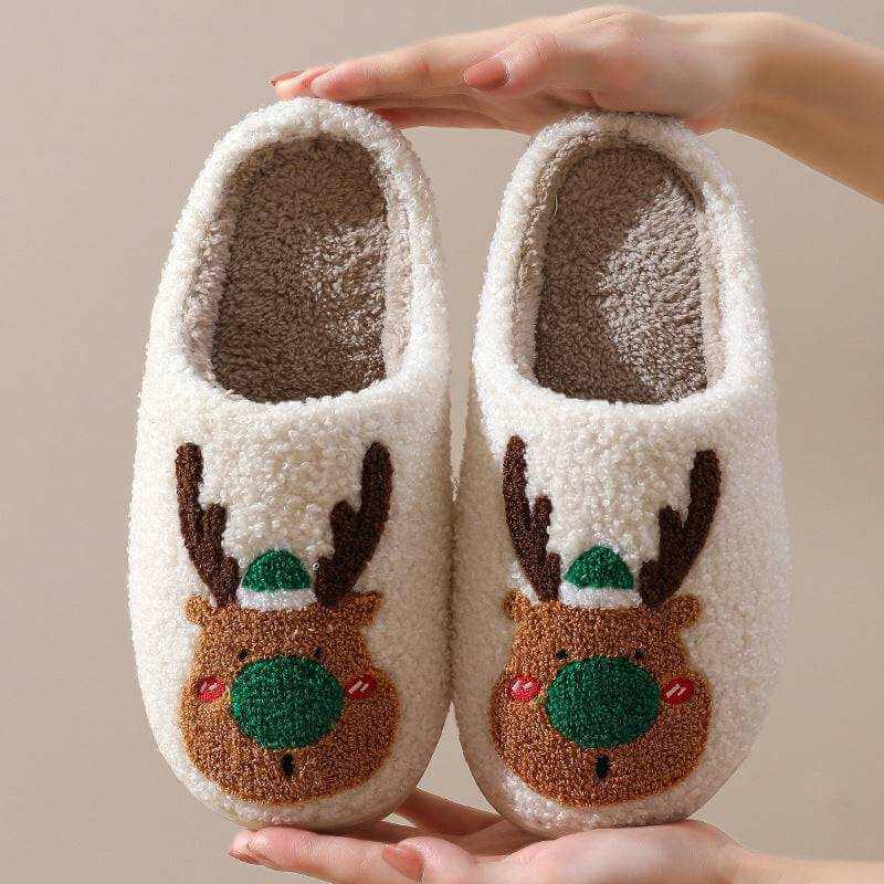 Cozy Elk Winter Home Slippers with plush white exterior and cute elk design, soft faux-wool lining, slip-on style, and anti-slip soles.