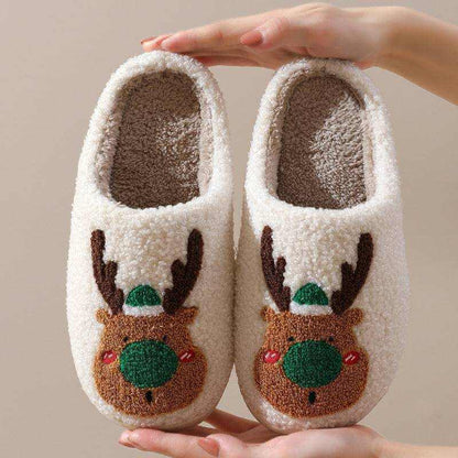 Cozy Elk Winter Home Slippers with plush white exterior and cute elk design, soft faux-wool lining, slip-on style, and anti-slip soles.