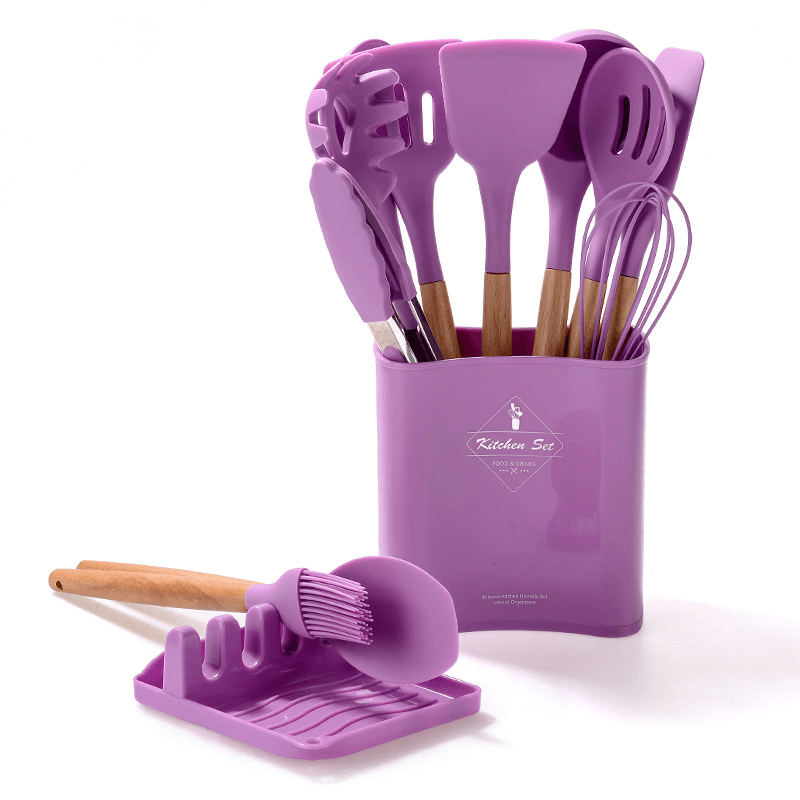 12-piece silicone kitchen tools set with wooden handles in purple, featuring spatulas, whisks, and more.