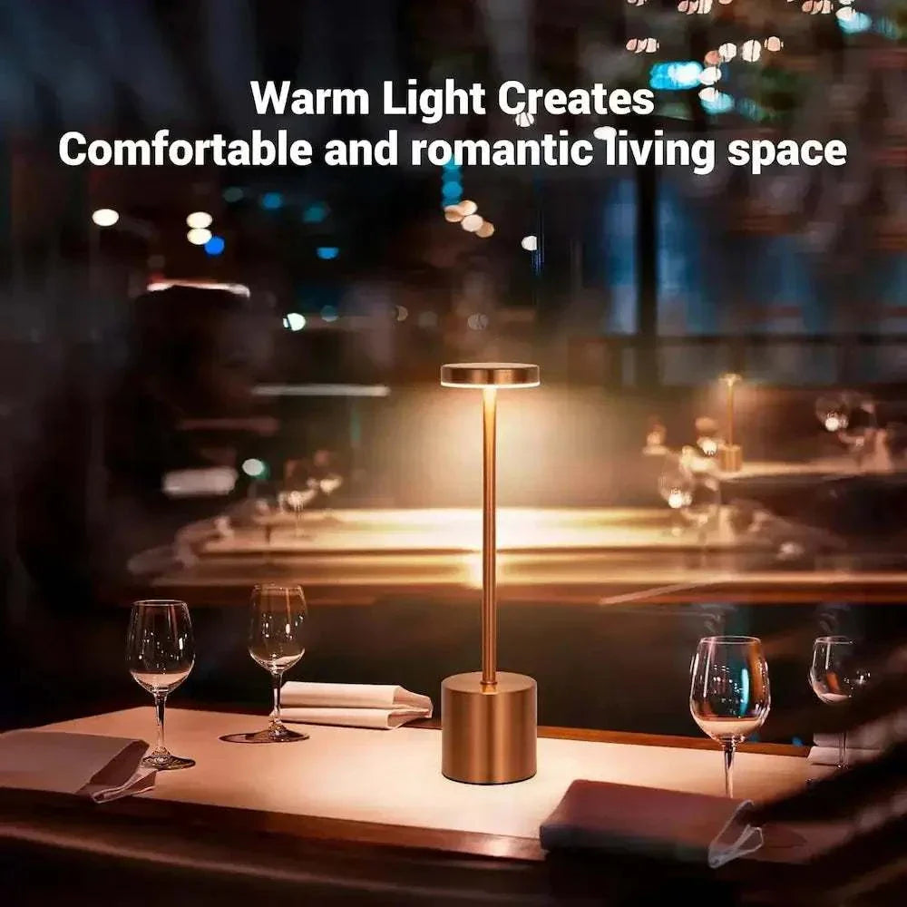 TouchGlow LED lamp with warm light creating a romantic atmosphere in a dining space.