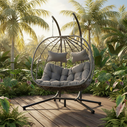 Double Hanging Egg Chair with cushions, ergonomic design for two-person comfort, outdoor or indoor use.