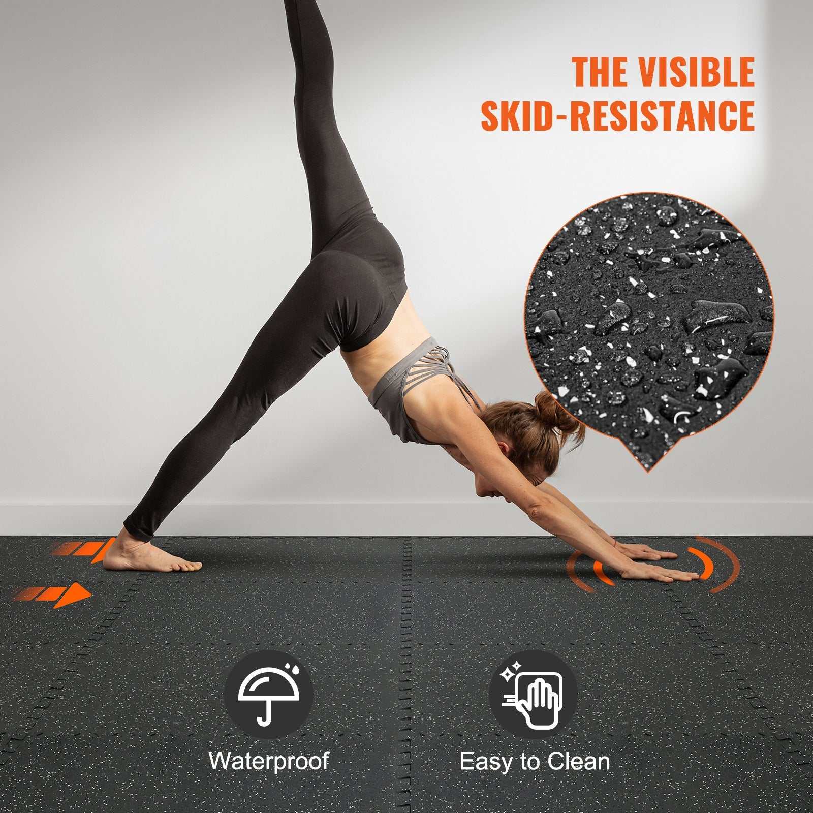 Woman doing yoga on waterproof, skid-resistant black gym floor mats easy to clean for home workouts