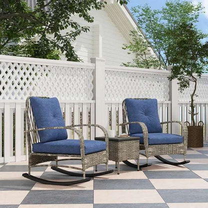 Cozy outdoor setup with Rattan Chaise Lounge Chair set and blue cushions on a patio with lattice fence and trees.