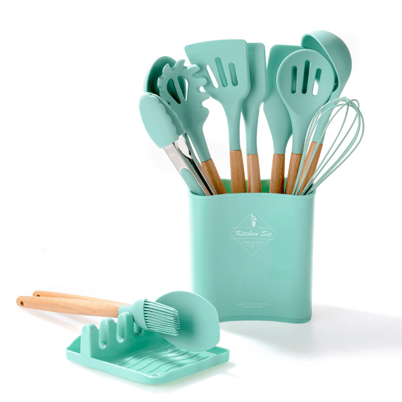 12-piece silicone kitchen tools set with wooden handles in mint green, including spatulas, tongs, and whisk.