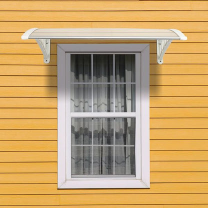 Transparent RainGuard Awning installed above window with yellow siding background