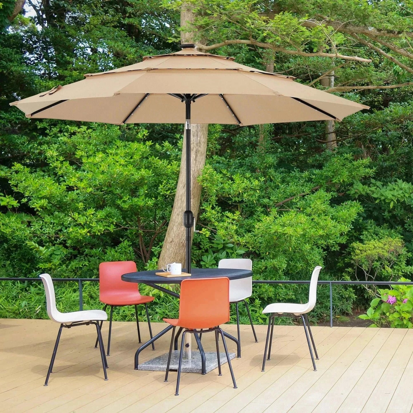 Patio Umbrella Solar Glow with LED beige umbrella providing shade over outdoor dining set surrounded by greenery