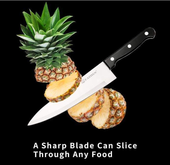 Ultimate German Steel Knife slicing fresh pineapple with sharp blade on black background