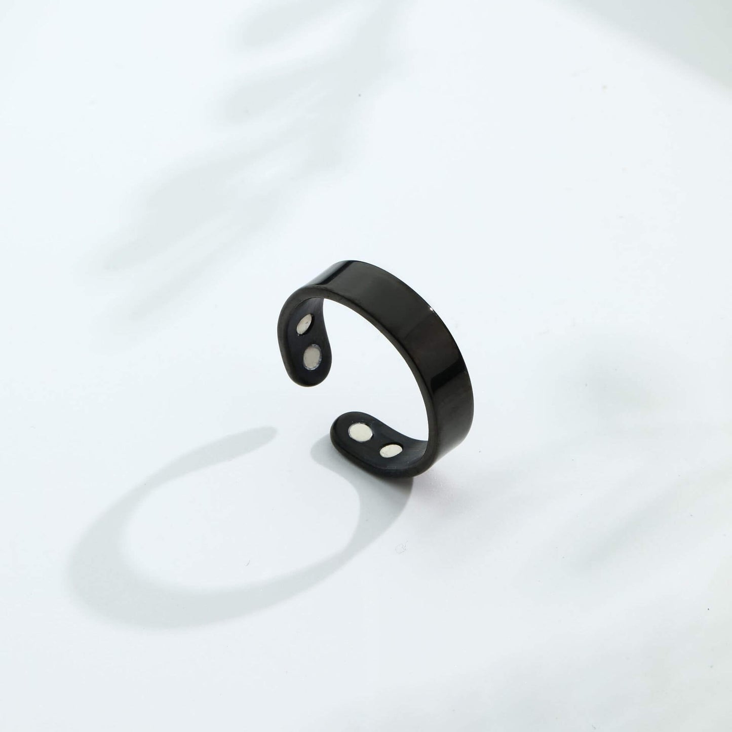Magnetic Ring for Calm Nights displayed on a white surface, showcasing its minimalist design and subtle magnetic elements.