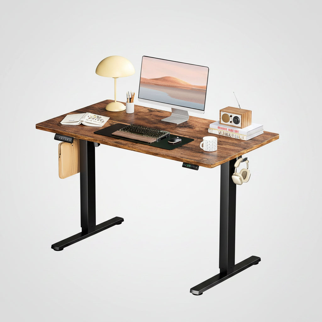 Ergonomic Height Adjustable Desk with laptop, lamp, and accessories in a modern office setup