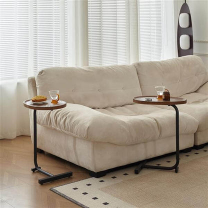C shaped side table brown MDF top with drink and book on surface