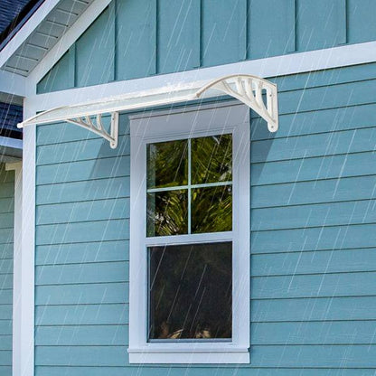 Heavy-duty clear RainGuard Awning with aluminum brackets installed above a window to protect from rain and sun
