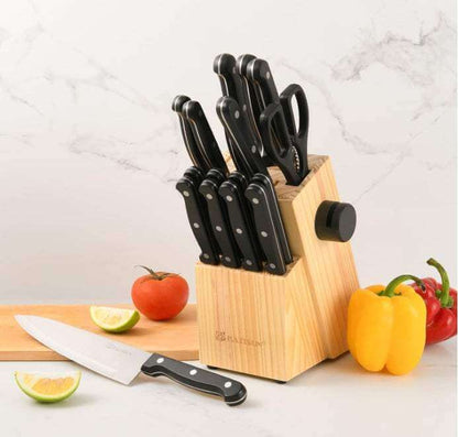 Ultimate German Steel Knife Set with wooden block and built-in sharpener on kitchen counter with vegetables and lime wedges