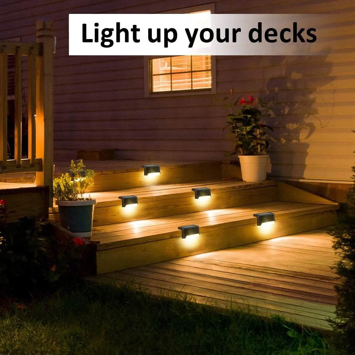 solar deck light set illuminating outdoor stairs with warm white glow at night