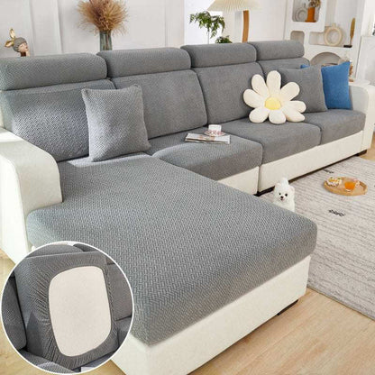 Elastic Sofa Slipcover on modern sofa in living room, showcasing protective, textured design for all-season use
