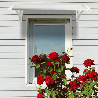 Weatherproof clear RainGuard Awning door canopy with aluminum brackets over window and red roses beneath