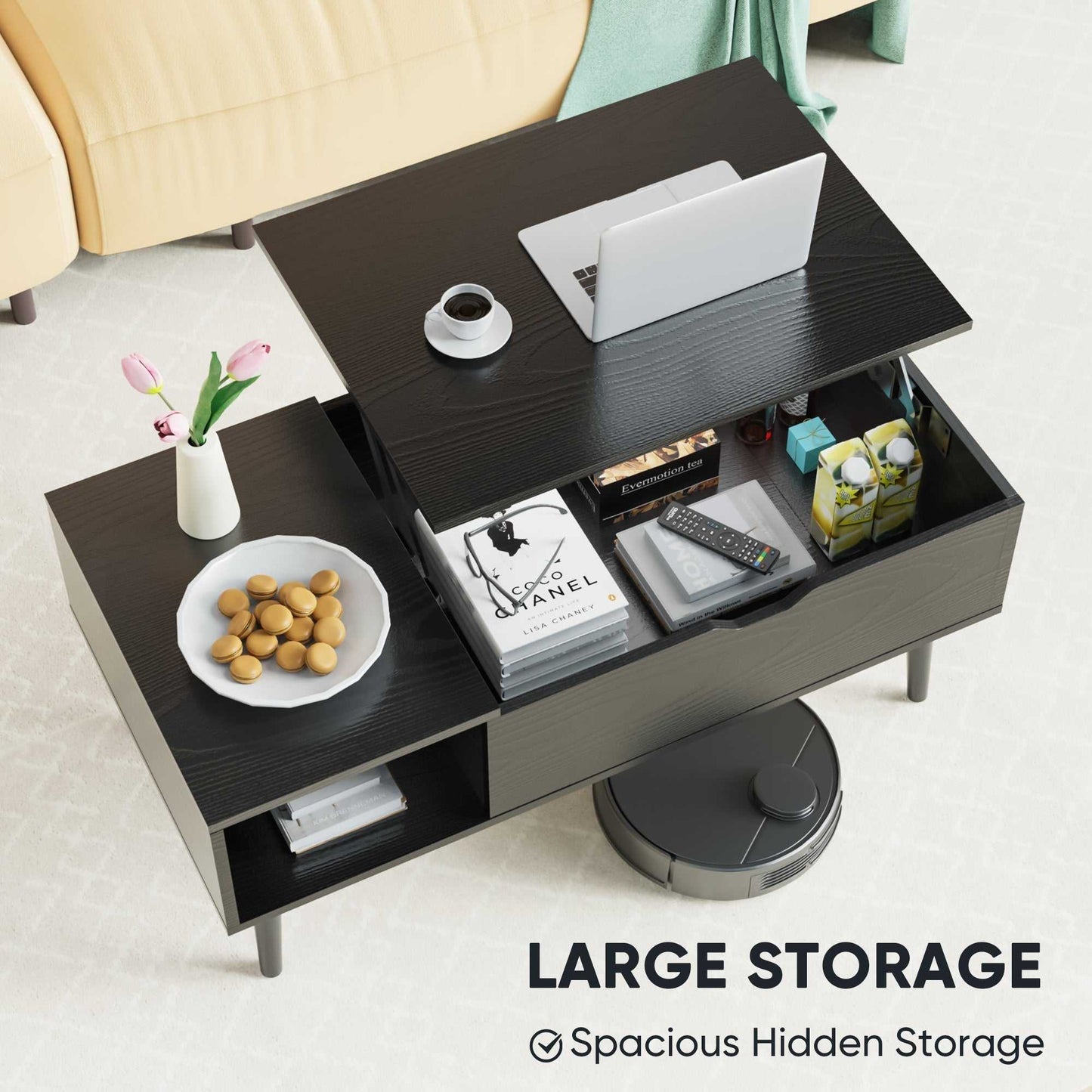 Modern black lift top coffee table with storage, laptop, coffee cup, and hidden compartment with books and snacks.