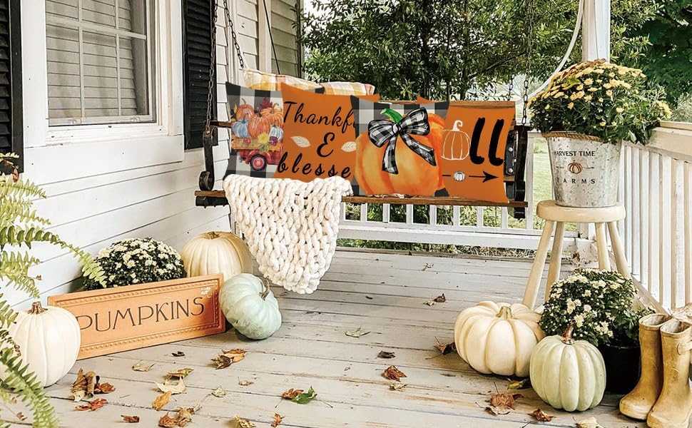 Charming Autumn Pillow Covers Set with fall designs on porch swing surrounded by pumpkins and fall decor