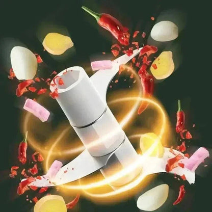 Compact hand-crank food chopper in action, mincing garlic, onions, and spices for efficient food preparation.